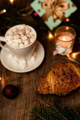 Croissant and marshmallow on the New Year's table. Romantic Family Evening
