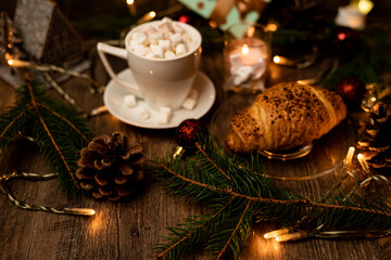 Obraz na płótnie Canvas Croissant and marshmallow on the New Year's table. Romantic Family Evening