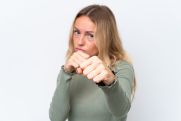 Young Russian woman isolated on white background with fighting gesture