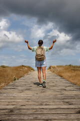 Inspired Woman Reaching for the Heavens