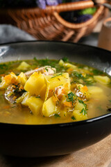 Cucumber soup in dark bowl.