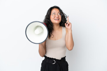 Young asian woman isolated on white background holding a megaphone and intending to realizes the...