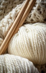 White Wool Yarn and Knitting Needles Close-Up