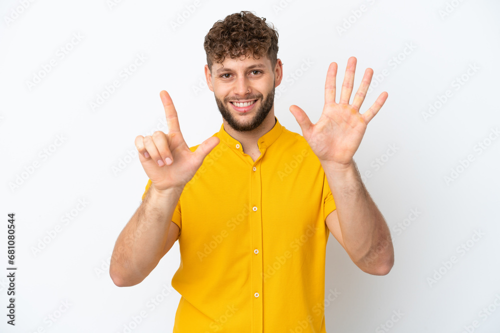 Canvas Prints Young handsome caucasian man isolated on white background counting seven with fingers