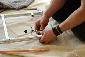 Plumber assembling a chrome tap fitting