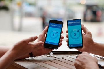 Business people using banking mobile application when transferring money