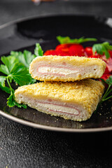 chicken cutlet cordon bleu fresh meat, cheese, bacon appetizer meal food snack on the table copy space food background rustic top view