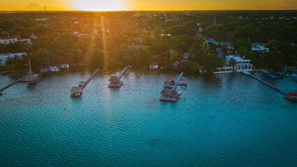 Aerial of seven colours lake lagoon in Bacalar Mexico drone fly above beach resort town in Quintana...