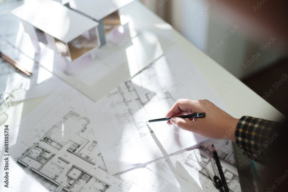 Wall mural architects interior designer hands working with blue prints and documents for a home renovation for 