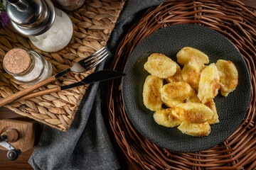 Homemade lazy noodles with cheese, crumbs and melted butter.
