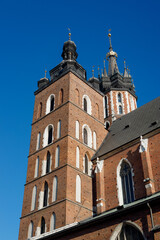 St. Marys Basilica at the Main Square in the Old Town, Krakow, Poland. Detail of domes of Gothic Saint Mary Basilica. Traveling Europe