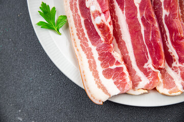 bacon slice fresh meat pork eating appetizer meal food snack on the table copy space food background rustic top view