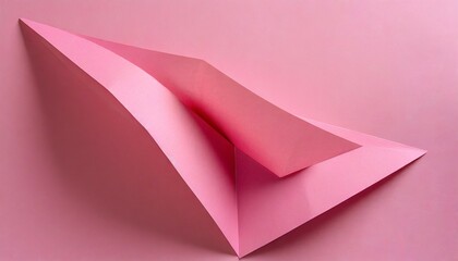 folded pink paper on pink background