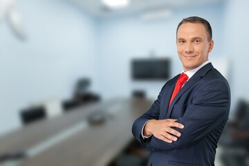 Handsome business man smiling at camera.