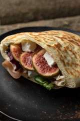 delicious pita with meat and cheese