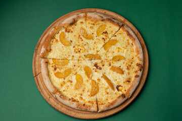 delicious pizza with oranges and cheese
