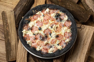 tasty pizza with salami and cheese