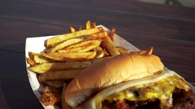 Close up of a gourmet hamburger and hand cut fries