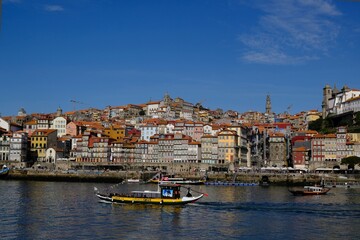 Panorama of Porto and tourist boat on Douro river, Portugal