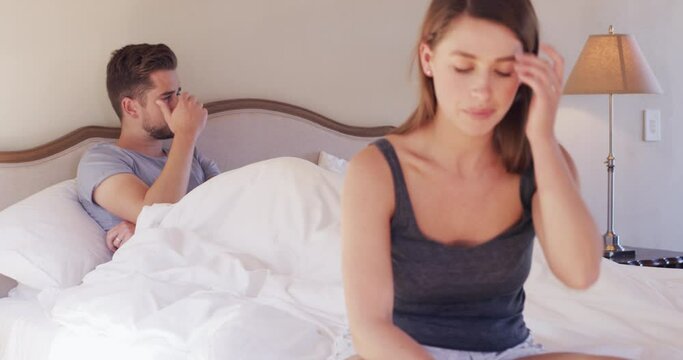 Couple, stress and sad on bed with fight, erectile dysfunction or anger with affair, bad news or divorce. Woman, man and frustrated with conflict, marriage or cheating in morning, home and bedroom