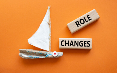 Role changes symbol. Concept words Role changes on wooden blocks. Beautiful deep blue background...