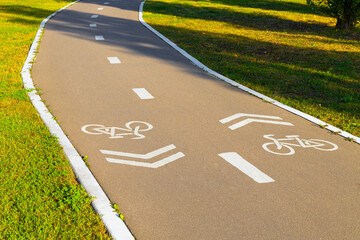 empty bike path with markings in the park.