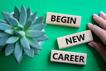 Begin new career symbol. Concept word Begin new career on wooden blocks. Businessman hand....