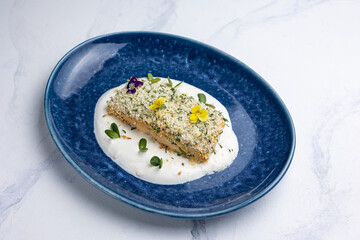 Baked salmon fillet on a blue plate