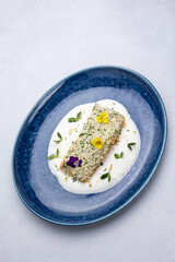 Baked salmon fillet on a blue plate