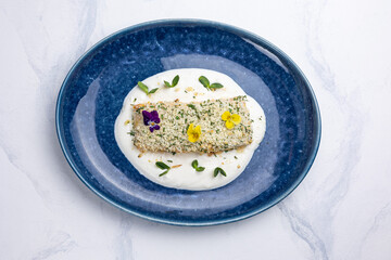 Baked salmon fillet on a blue plate