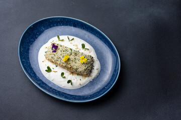 Baked salmon fillet on a blue plate