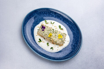 Baked salmon fillet on a blue plate