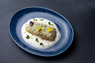 Baked salmon fillet on a blue plate