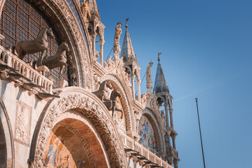 Beautiful Saint Marks Basilica building in Venice, Italy. Capture the essence of this stunning city with this captivating image. St. Marks Basilica - obrazy, fototapety, plakaty