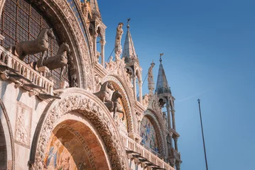 Papier Peint photo Gondoles Beautiful Saint Marks Basilica building in Venice, Italy. Capture the essence of this stunning city with this captivating image. St. Marks Basilica