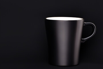 A black cup with a white interior background, on a black background.