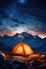 A tent pitched up in the mountains at night.