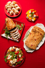 Traditional festive Christmas dishes on the table. Wellington with mushrooms, stuffed turkey roll