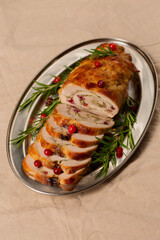 Christmas roll of turkey fillet stuffed with mushrooms and cheese