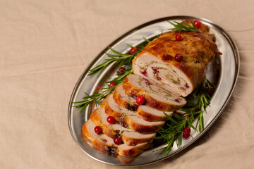 Christmas roll of turkey fillet stuffed with mushrooms and cheese