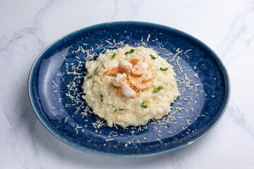 Risotto with shrimps on a white background.