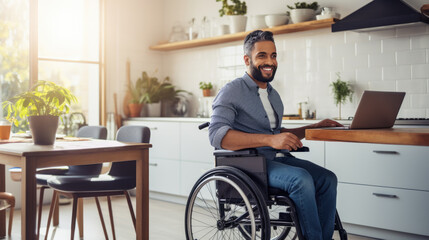 Smiling man in a wheelchair works from his home office.