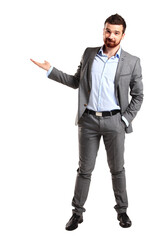 full length portrait of a young casual man presenting something in the back isolated on transparent background - obrazy, fototapety, plakaty