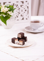 Candies in chocolate glaze with milky air filling