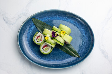 A delicious Japanese dish. Rolls with avocado, cucumber, caviar