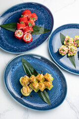 A delicious Japanese dish. Rolls with avocado, cucumber, caviar