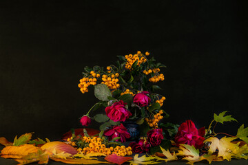 Autumn flowers. Composition of autumn flowers, berries, leaves.