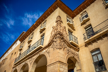 Fototapeta na wymiar 18th century building of the first instance courts of Lorca, Murcia, former Casa del Corregidor, with arches and large reliefs