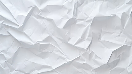 Obraz premium A crumpled white paper texture with multiple creases and folds creating an abstract pattern.