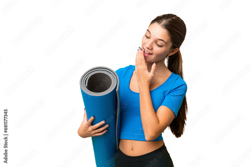 Canvas Prints Teenager caucasian girl going to yoga classes while holding a mat over isolated background with surprise and shocked facial expression